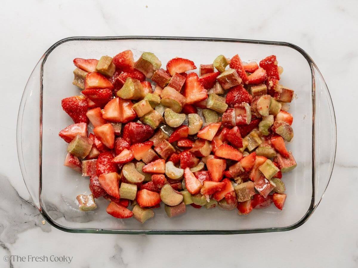 Strawberry rhubarb filling placed in a glass baking dish.