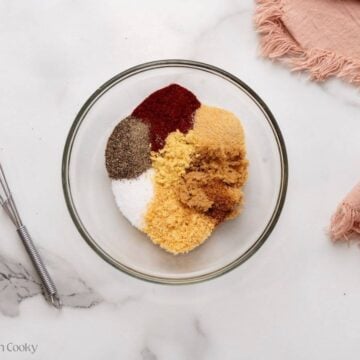 Ingredients for burger seasoning in a small bowl before mixing together.