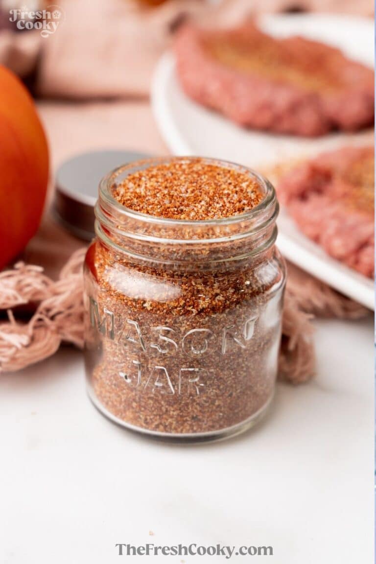 Jar near hamburger patties filled with burger seasoning, for pinning.
