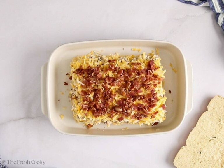 Bacon layer added on top of the cheese layer on the bottom half of the rolls.