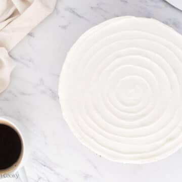 Swirled design on top of the top layer of cheesecake.