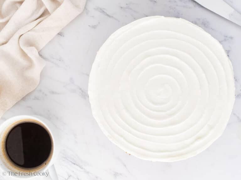 Swirled design on top of the top layer of cheesecake.