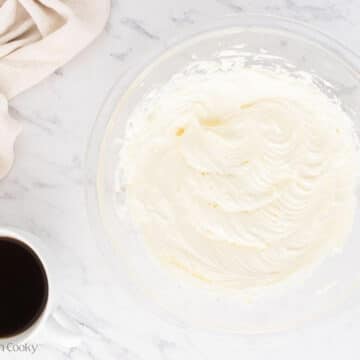 Whipping up the cream cheese in a bowl.