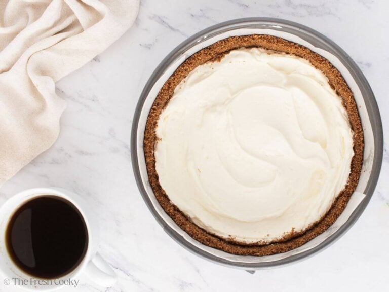 Layer of cream cheese filling in the graham cracker crust.