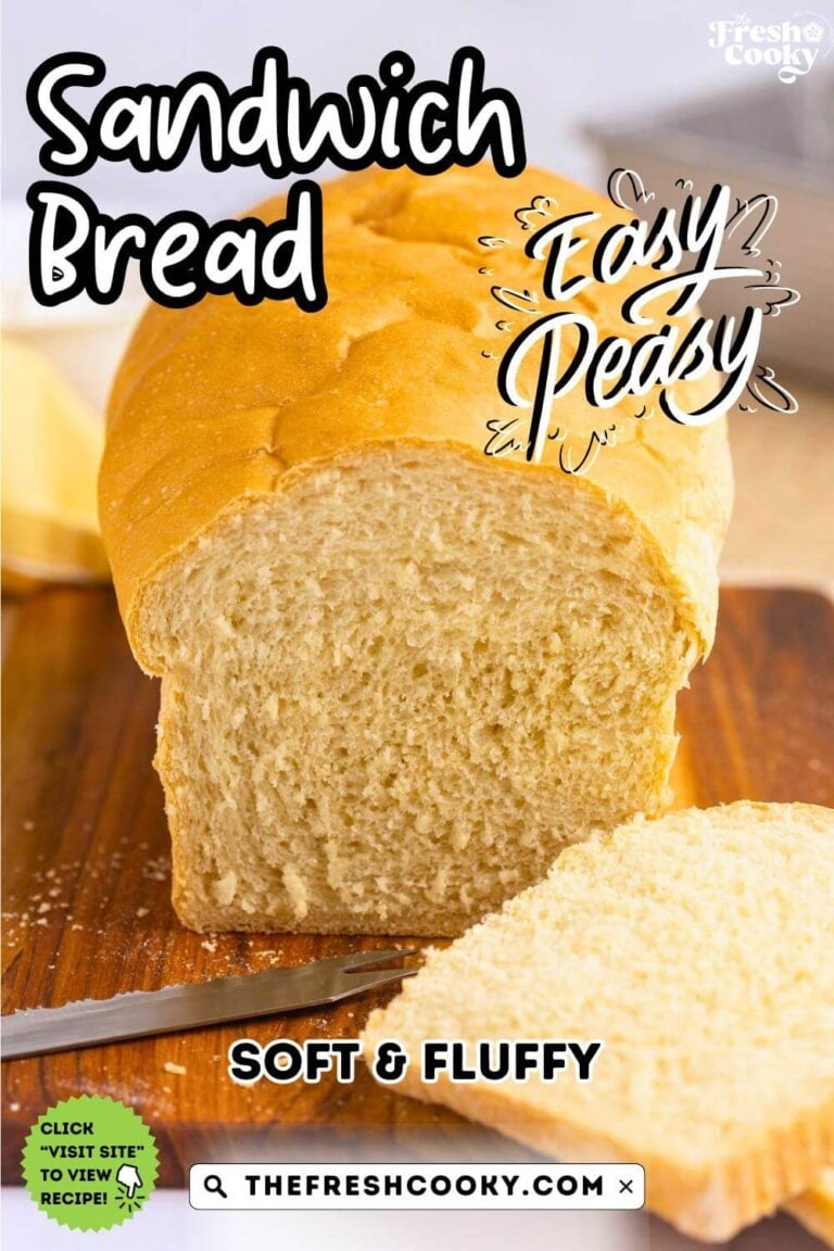 Loaf of white sandwich bread on cutting board with a few slices sliced, for pinning.