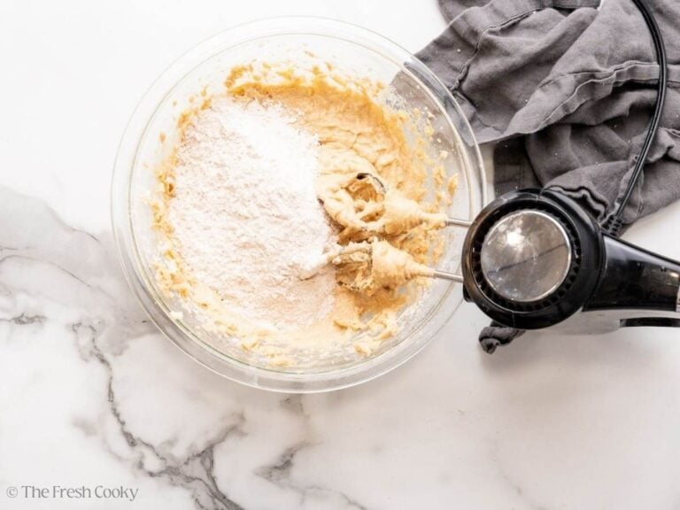 Dry ingredients added to the cinnamon bread in increments.