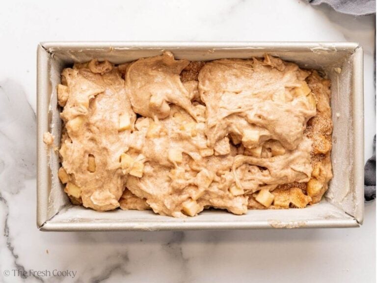 Another layer of apple bread dough added on top of the cinnamon bread layer.
