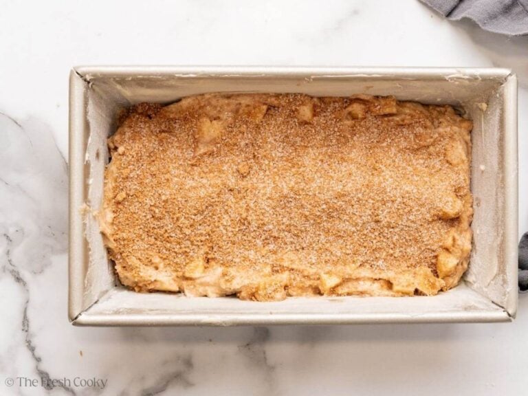 Layer of cinnamon sugar on top of a layer of the apple bread dough.