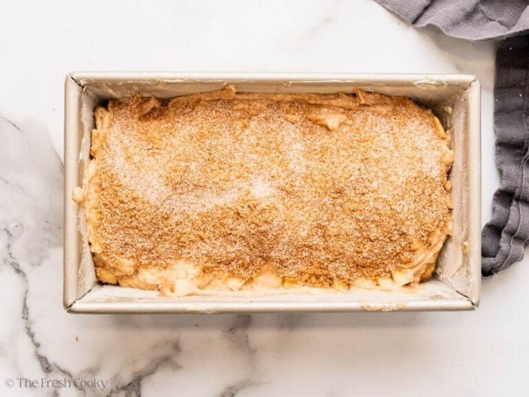 More cinnamon sugar added on top of the apple bread dough.