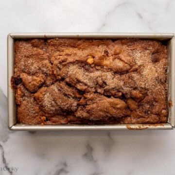 Apple cinnamon bread in a loaf pan after baking.