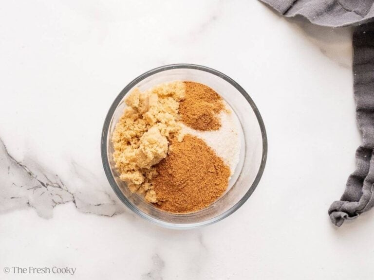 Both brown and granulated sugar with cinnamon in a bowl.