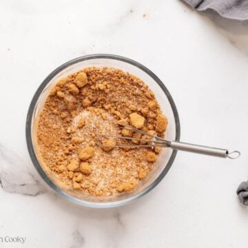 Sugars and cinnamon whisked together in a bowl.
