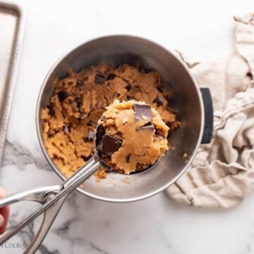 Scooping cookie dough with cookie scoop.