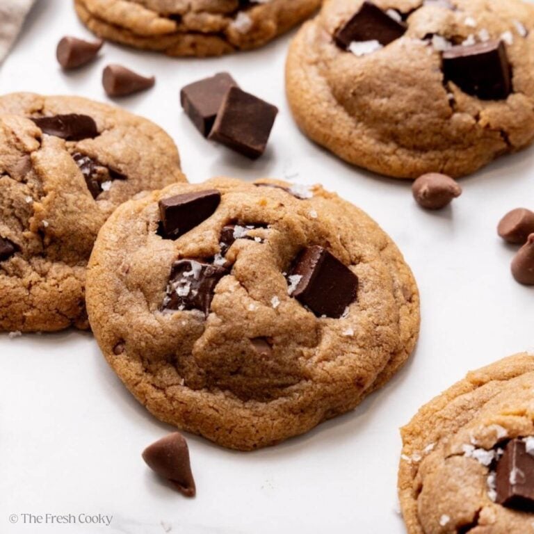 Layers of freshly baked brown butter chocolate chip cookies with puddles of gooey chocolate and topped with flaky sea salt.