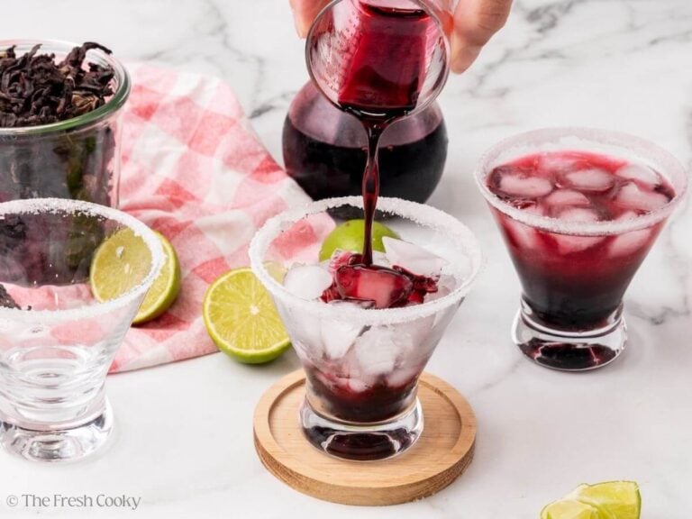 Adding hibiscus syrup over ice.
