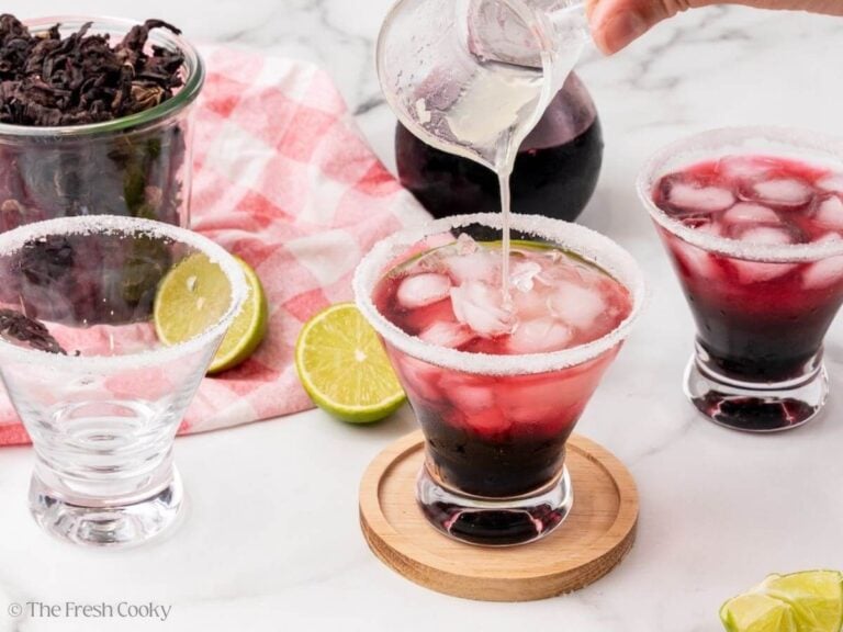 Adding lime juice to margarita glass.