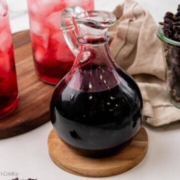 A pretty pitcher filled with hibiscus syrup.