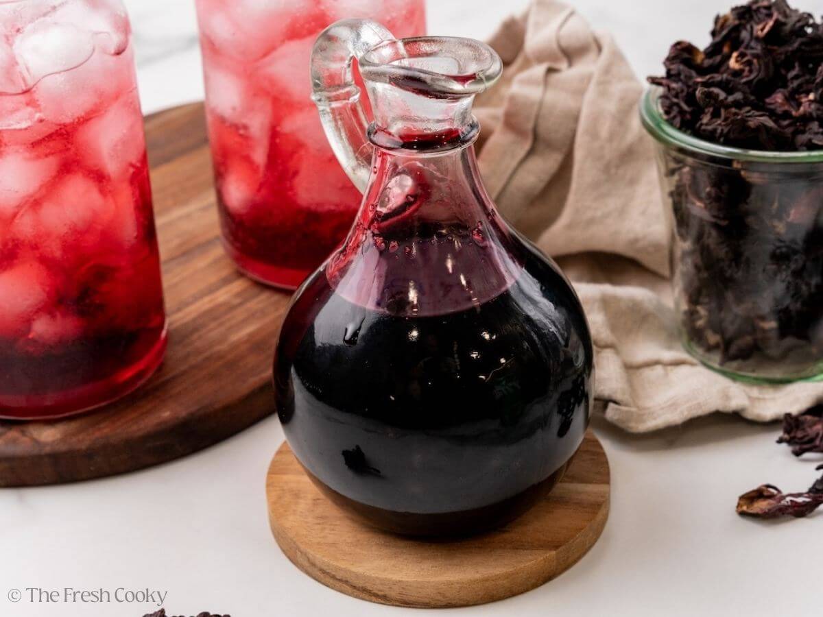 A pretty pitcher filled with hibiscus syrup.