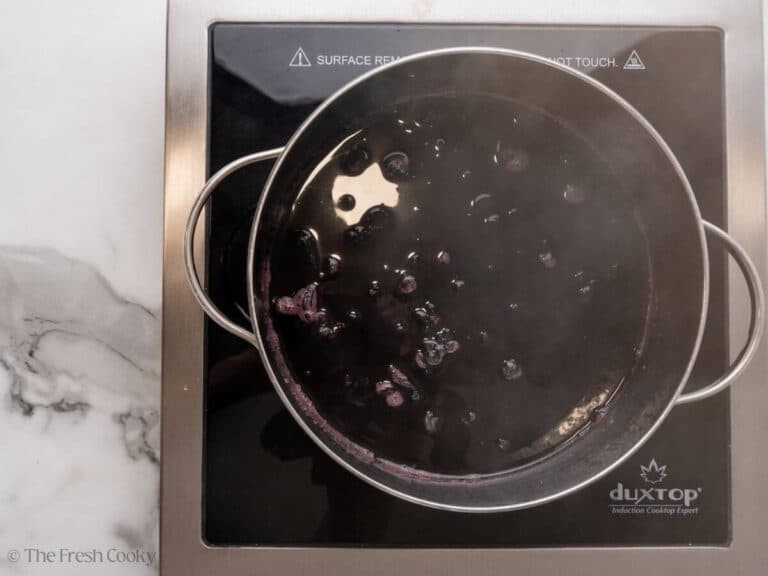 Adding all ingredients to a pot.