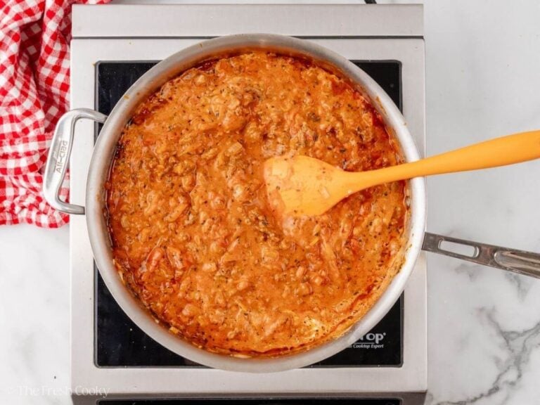 Baked rigatoni meat sauce ready in a skillet.