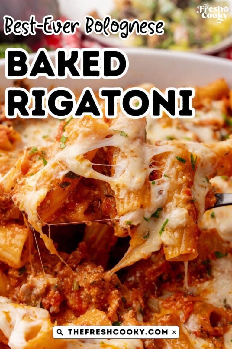 Baked rigatoni being spooned out of dish, for pinning.