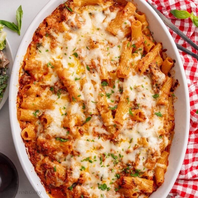 Baked rigatoni bolognese in oval staub baker.