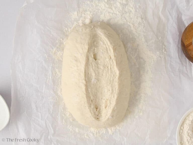 Slice made in the top of a shaped piece of bread dough.