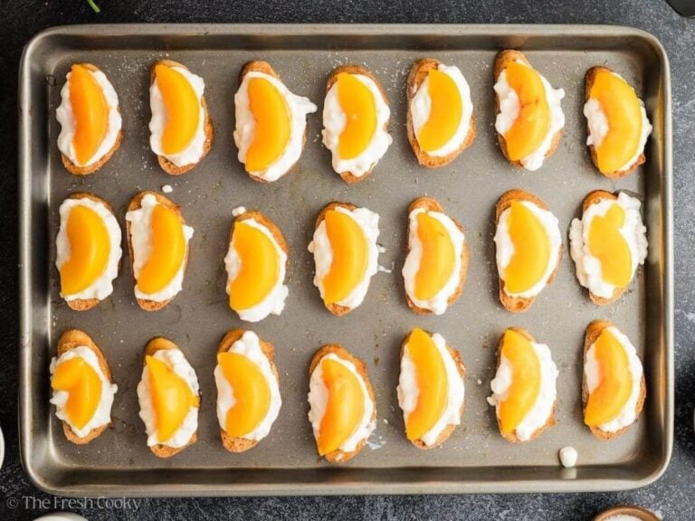 Place a peach slice on each piece.