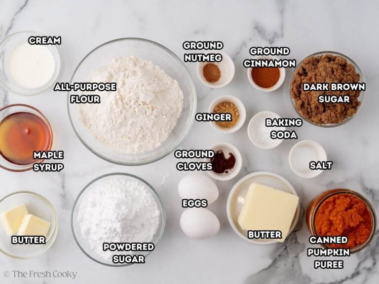 Ingredients needed to make pumpkin bread on a kitchen counter.