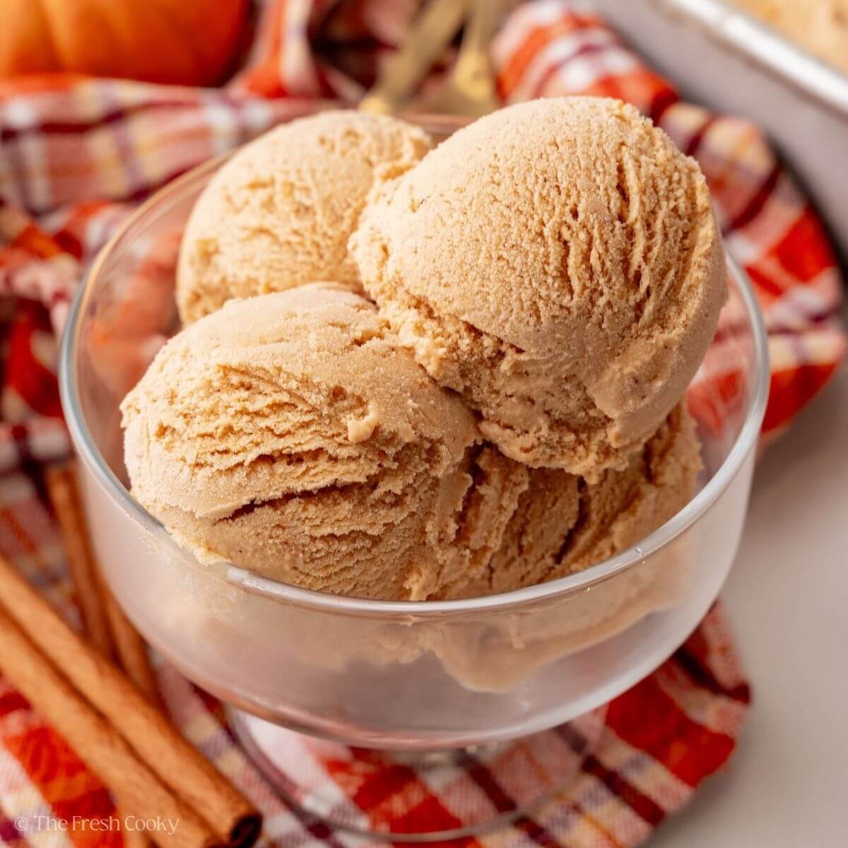 Three scoops of creamy pumpkin pie ice cream.