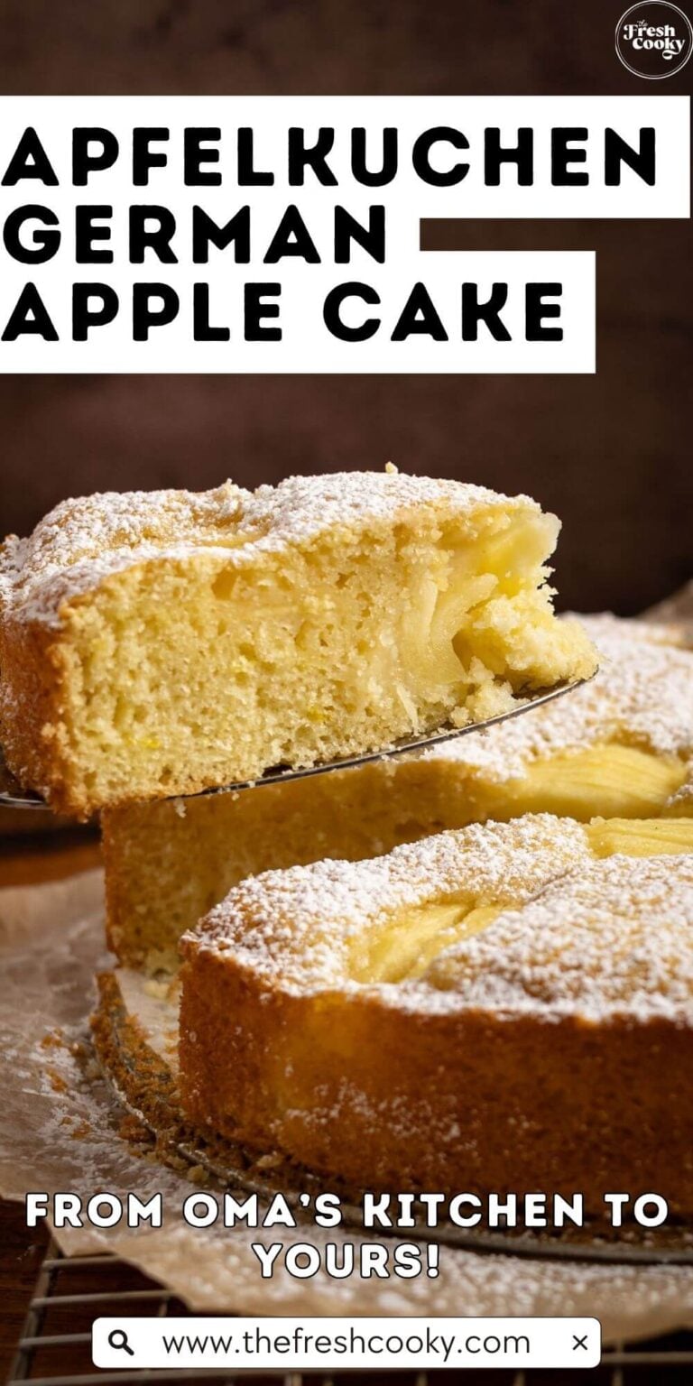 Holding up a tender slice of German apple cake, sunken apple cake, to pin.
