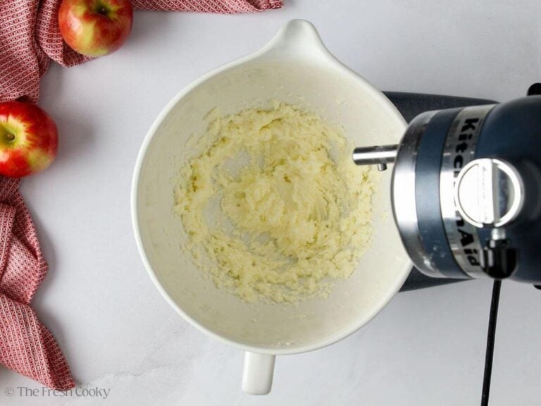 Creaming butter and sugar together in the bowl of a stand mixer.