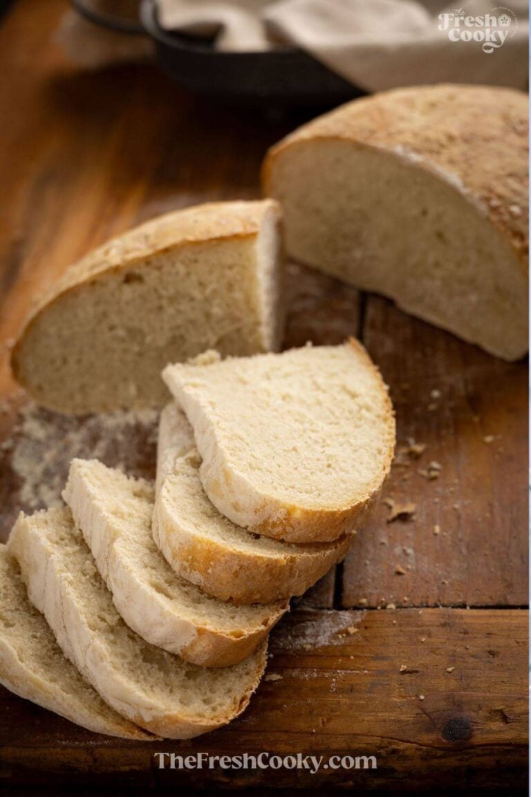 Slices of Italian bread on cutting board, to pin.
