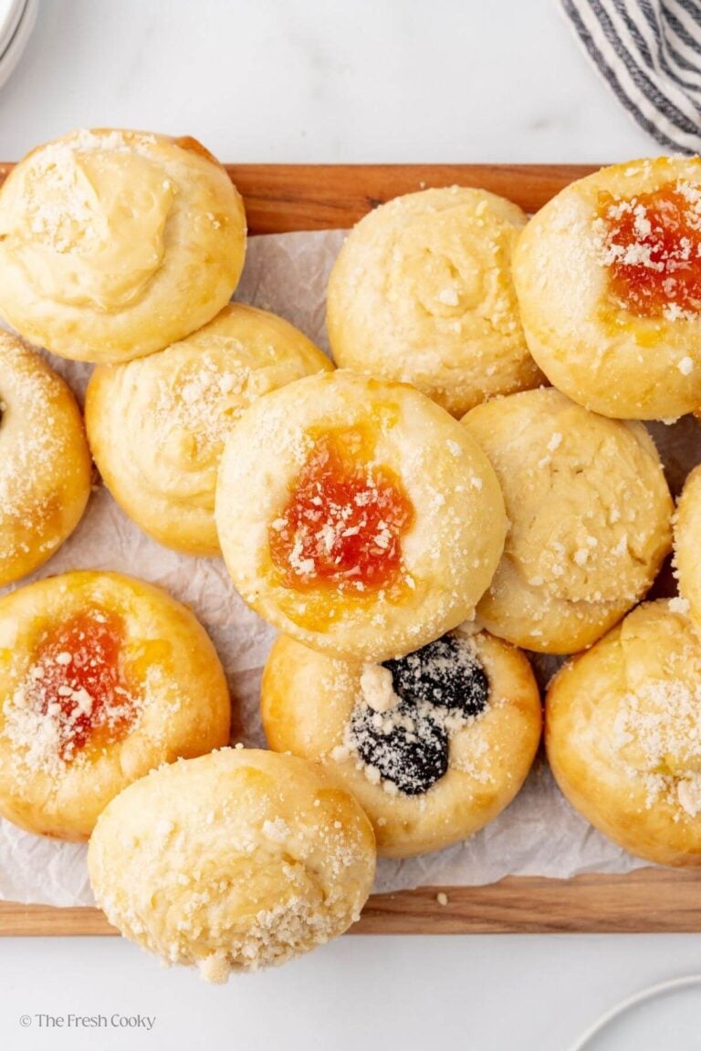 Bunch of kolaches on a cutting board.