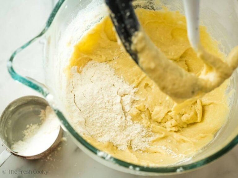 Adding a little flour to the bread dough.