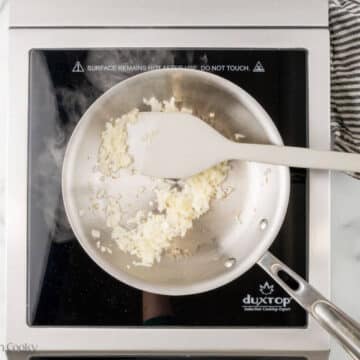 Sauteed onion in a skillet.