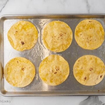 Corn tortillas sprayed with oil and baked in the oven.