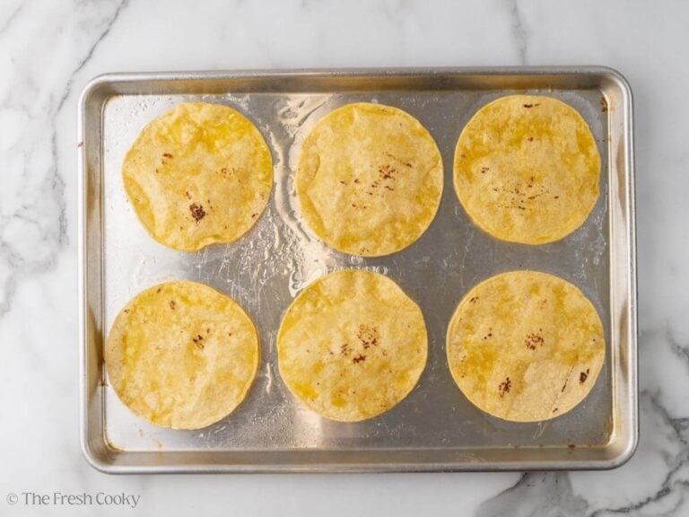 Corn tortillas sprayed with oil and baked in the oven.