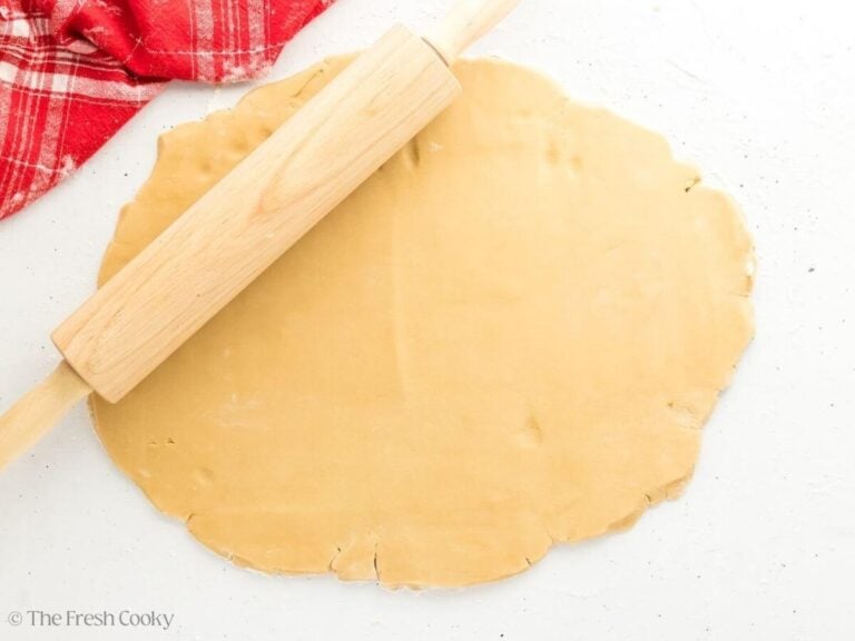 Shortbread cookie dough rolled out into a thin layer.