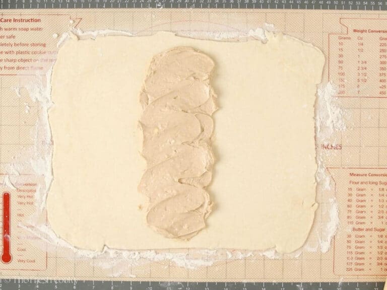 Cream cheese filling layered in the middle of the dough rectangle.