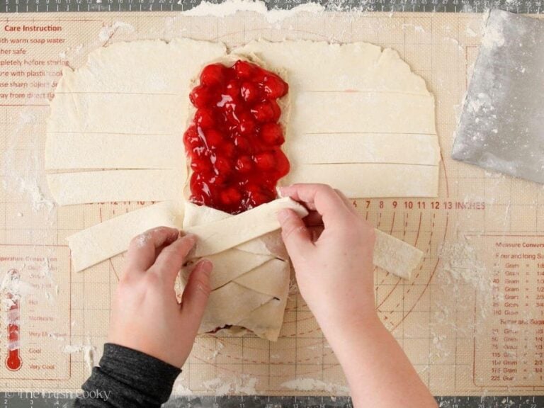 Folding the strips of dough over top the filling.