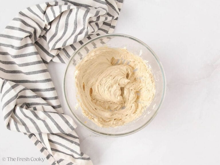Cream cheese filling whipped together in a mixing bowl.