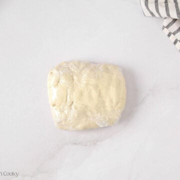 Kringle dough wrapped in plastic wrap.