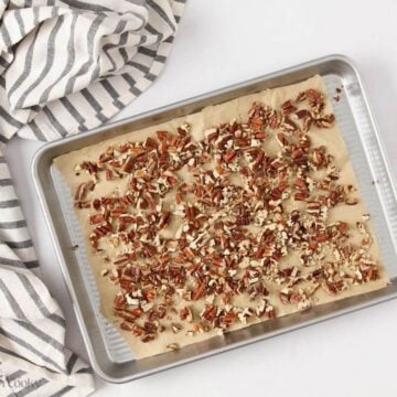 Toasted pecans on a sheet pan.