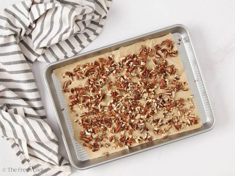 Toasted pecans on a sheet pan.