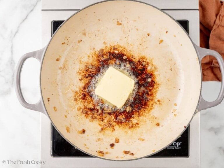 Butter in a skillet after searing the meatballs.