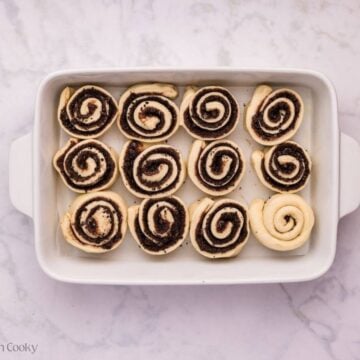 Oreo cinnamon rolls placed in a baking dish to rise again.