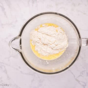 Flour added to the mixing bowl.