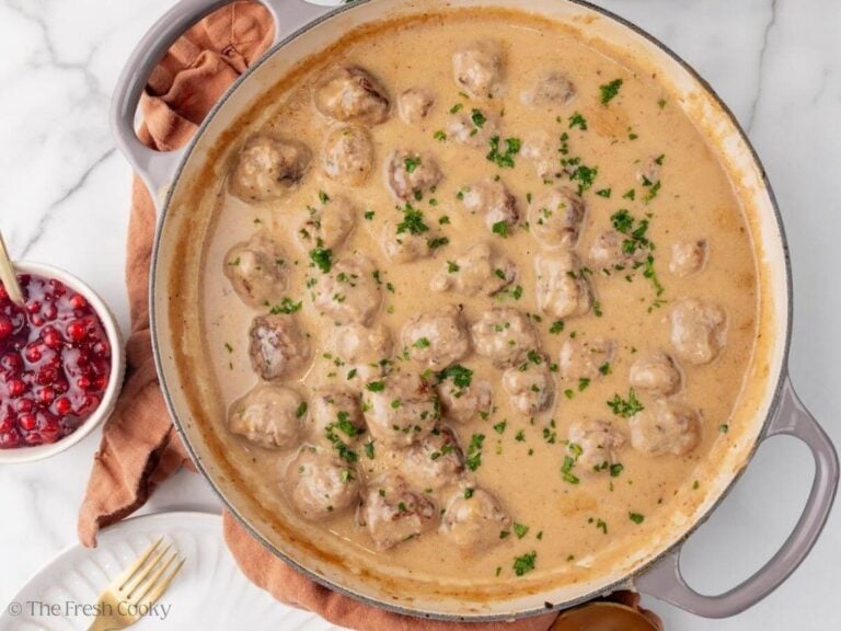 Homemade Swedish meatballs in a skillet with parsley on top.