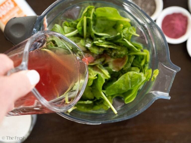 Liquid being added to the vegetable and fruit smoothie.